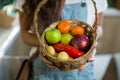 Woman holding a basket of fruits and vegetables in the grocery store Royalty Free Stock Photo