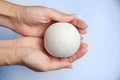 Woman holding bath bomb over foam Royalty Free Stock Photo