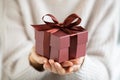 Woman holding beautiful and elegant gift box