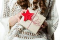 Woman holding beautifuly wrapped present, xmas concept