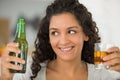 woman holding beer bottle and glass Royalty Free Stock Photo