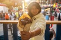 woman holding Belgian french fries with sauce at food court. street food festival Royalty Free Stock Photo