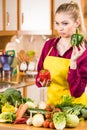 Woman holding bell peppers paprika thinking