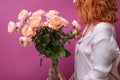 Woman holding a big bouquet of pink roses Royalty Free Stock Photo