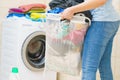 Woman holding laundry basket full of clothes Royalty Free Stock Photo