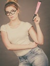 Woman holding big oversized pencil thinking about something Royalty Free Stock Photo