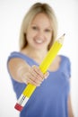 Woman Holding Big Pencil Royalty Free Stock Photo