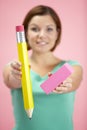 Woman Holding Big Pencil And Eraser Royalty Free Stock Photo