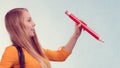 Woman holding big pencil Royalty Free Stock Photo