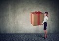 Woman holding a big present gift box Royalty Free Stock Photo