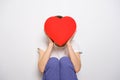 Woman holding a big red box in shape of a heart. Trendy video banner for Valentines Day, International Womens Day or Royalty Free Stock Photo