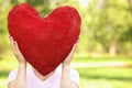 Woman holding big red heart before her face Royalty Free Stock Photo