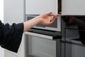 Woman holding big white cupboards storage door Royalty Free Stock Photo