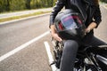 woman holding bike helmet in hands