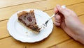 Woman holding a bite of pecan pie on her fork Royalty Free Stock Photo