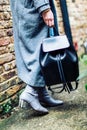 Woman holding black leather backpack Royalty Free Stock Photo