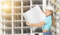 Woman holding blank drawing sheet in front of