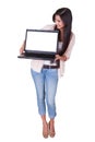 Woman holding a blank laptop