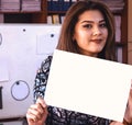 Woman holding a blank paper