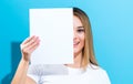 Woman holding a blank sheet of paper Royalty Free Stock Photo