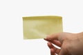 Woman holding a blank yellow sticky note isolated on white background, space for text Royalty Free Stock Photo