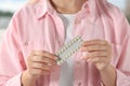 Woman holding blister of oral contraception pills, closeup Royalty Free Stock Photo