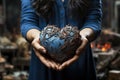 A woman holding a blue heart shaped object in her hands Royalty Free Stock Photo