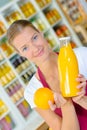 woman holding bottle orange juice Royalty Free Stock Photo