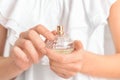 Woman holding bottle of perfume, closeup Royalty Free Stock Photo