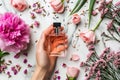 Woman holding bottle perfume flowers herb smell aroma advertising freshness design fragrance pink liquid luxury Royalty Free Stock Photo