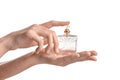 Woman holding bottle of perfume on white background Royalty Free Stock Photo
