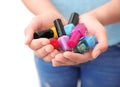 Woman holding bottles of colorful nail polishes, closeup Royalty Free Stock Photo