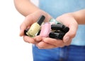 Woman holding bottles of colorful nail polishes, closeup Royalty Free Stock Photo