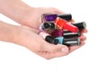 Woman holding bottles of colorful nail polishes on white background Royalty Free Stock Photo