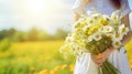 Woman Holding a Bouquet of Daisies in a Field Royalty Free Stock Photo