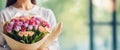 woman is holding a bouquet of flowers Royalty Free Stock Photo