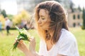 Woman holding a bouquet of lilly of valley flowers