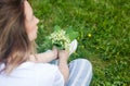 Woman holding a bouquet of lilly of valley flowers Royalty Free Stock Photo