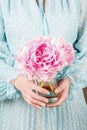 Woman holding bouquet of pink peonies Royalty Free Stock Photo