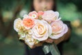 Woman holding a bouquet of roses