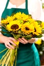 Woman holding bouquet sunflowers florist yellow flower Royalty Free Stock Photo