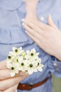 Woman holding bouquet of tiny white flowers (ornithogalum arabic Royalty Free Stock Photo