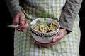 Woman holding a bowl of dumplings Royalty Free Stock Photo