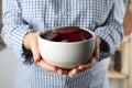 Woman holding bowl of pickled beets Royalty Free Stock Photo