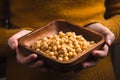 Woman holding a bowl of raw chickpeas Royalty Free Stock Photo