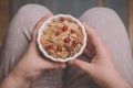 Woman holding bowl of tasty cereal corn flakes Royalty Free Stock Photo