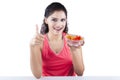 Woman holding a bowl of tomato Royalty Free Stock Photo