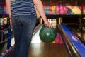 Woman holding a bowling ball at the bowling club Royalty Free Stock Photo