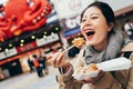 Woman holding box of japanese local street food Royalty Free Stock Photo