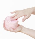 Woman holding a box with pink moisturizing hand cream